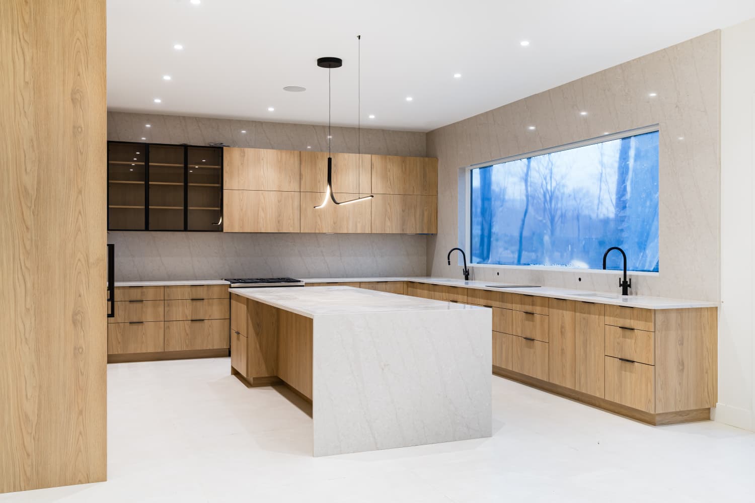Light oak kitchen with stone countertops, angle 4